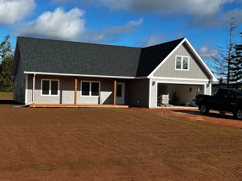 A completed white home built by Kueppers