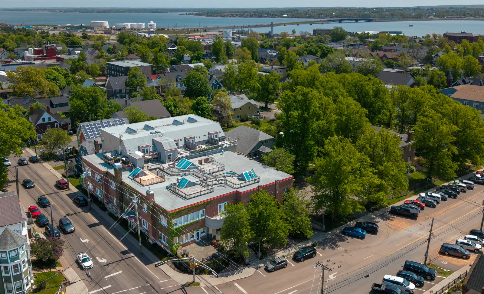 Aerial view of Y Lofts at 252 Prince Street in Charlottetown, with the harbour behind